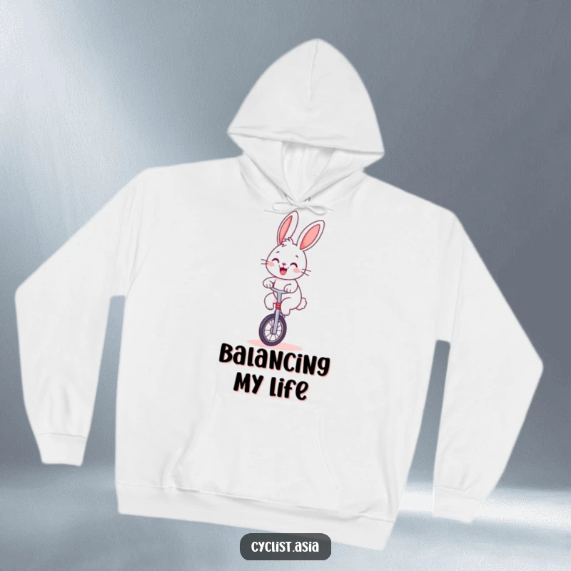 Funny bunny hoodie, soft and warm, with a cheerful bunny balancing on a unicycle, great humorous gift.