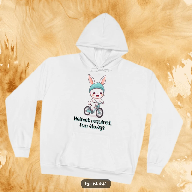Funny hoodie with a cheerful bunny wearing a helmet, gleefully riding a tiny bicycle. Cozy and full of positive vibes.
