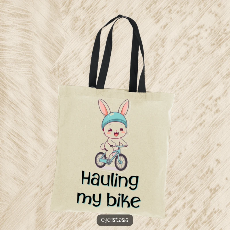 Funny tote bag showing a cheerful bunny wearing a helmet, gleefully riding a tiny bicycle. Practical and fun for everyday use.
